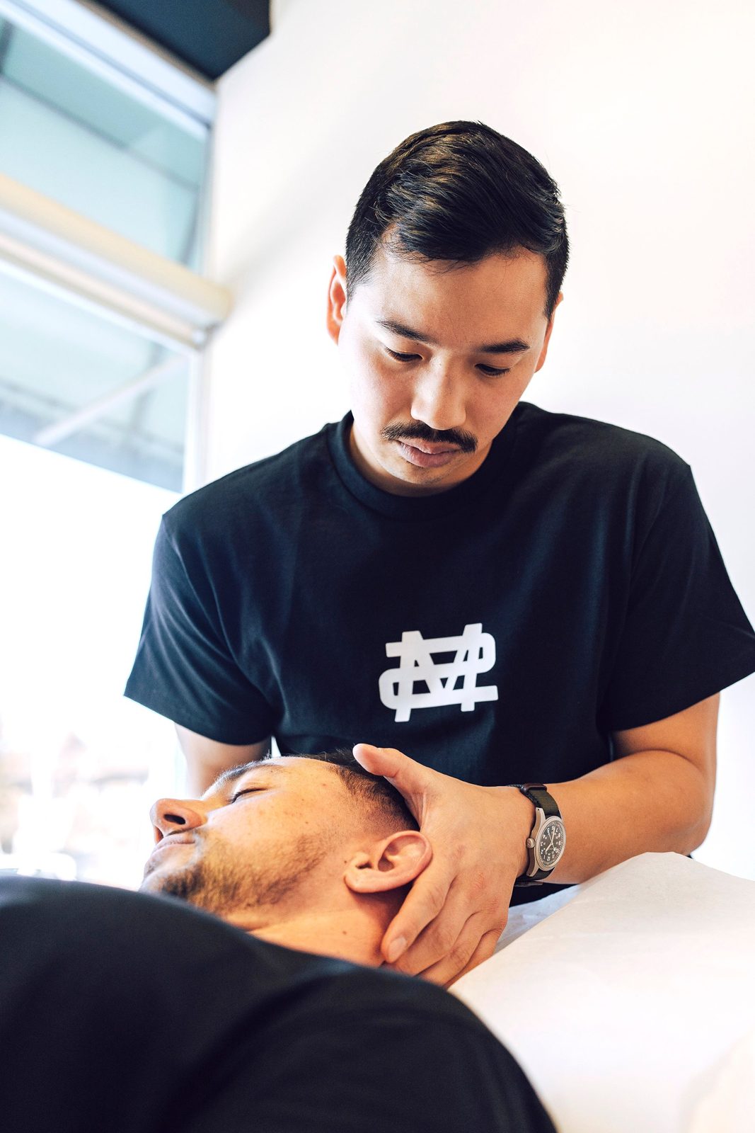 Modern Movement therapist providing hands-on neck treatment